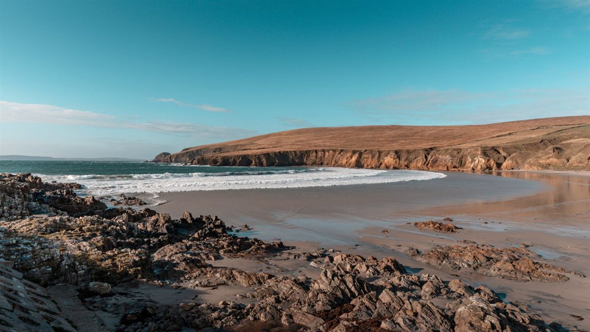 Rocky shore and sandy cove on the Irish coast